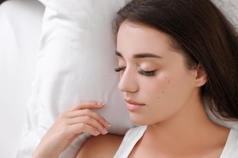 Woman Sleeping with Eyelash Extensions