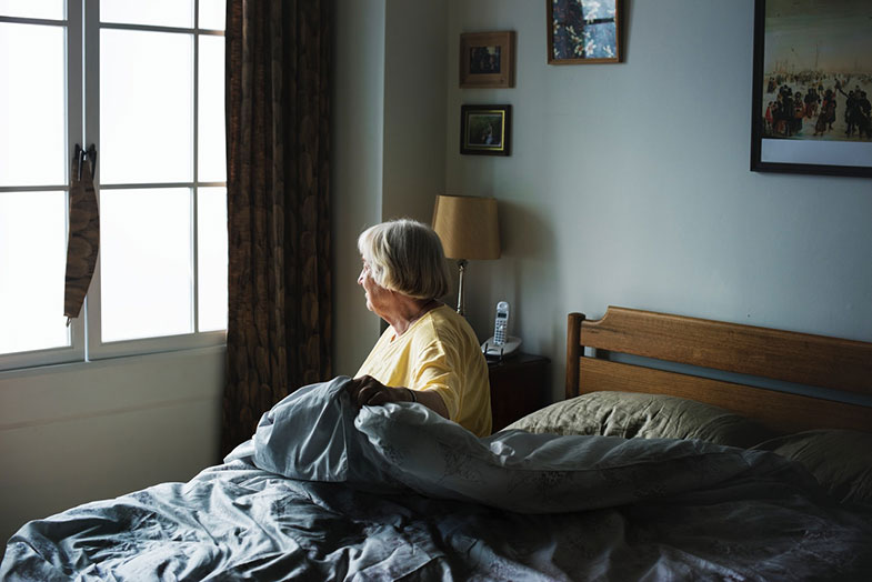 Elderly Woman in Bed