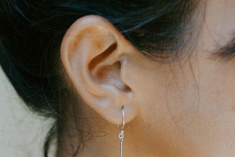 Woman Wearing Silver Colored Earring